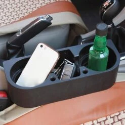 Merkloos Decopatent® Autostoel Organizer - Voor Tussen Auto Stoel / Console - Bekerhouder & Telefoonhouder - Opbergvakken - Auto Organiser -Lionelo Winkel 1200x1200 1211